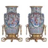 A pair of gilt mounted Chinese famille rose vases, the panels decorated with a scene from 'The Roman