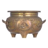 A Chinese relief decorated bronze tripod incense burner, the panels with birds, flowers and a dragon