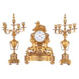 A gilt bronze Neoclassical three-piece clock garniture, decorated with putti, birds and gilt and pol