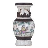 A Chinese crackleware stoneware polychrome vase, decorated with an animated scene, the back with cal