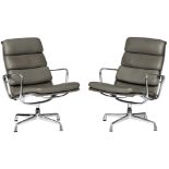A set of two chromed aluminium and grey leather upholstered EA216 softpad lounge chairs, design by C