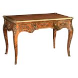 A fine Louis XV style kingwood veneered 'bureau plat', with gilt bronze mounts and a leather inlaid
