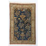 An Oriental woollen rug decorated with various birds and exotic animals, 171 x 267 cm