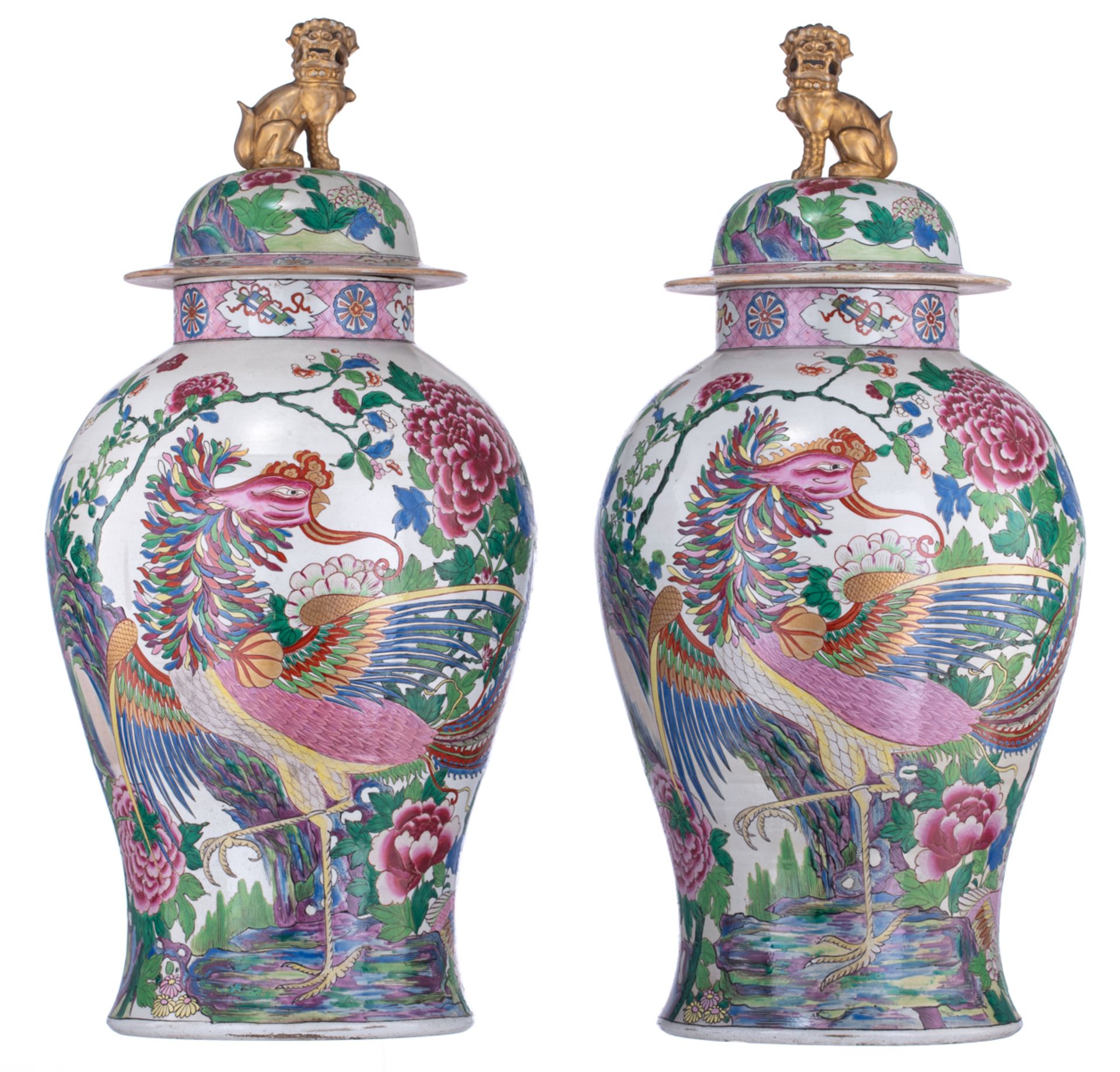 A large pair of covered famille rose Samson vases, decorated with birds and griffons in a floral set
