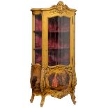 A gilt wooden Rococo style display cabinet, the roundels on the lower part depicting hand-painted ga