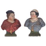 A pair of polychrome cold painted terracotta bookrests, shaped as the busts of a well-fed peasant co