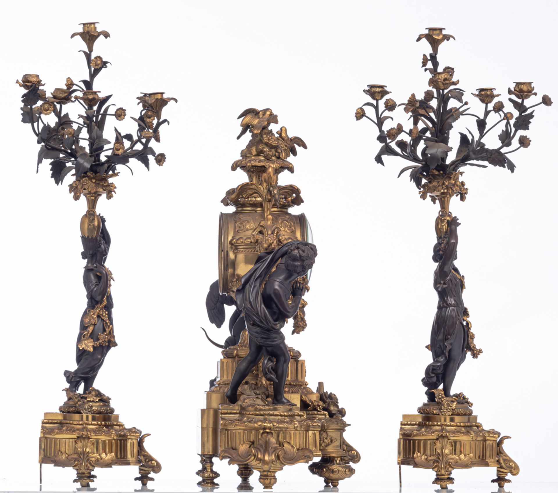 An imposing gilt and patinated bronze Neoclassical three-piece mantle clock garniture, the clock dec - Image 4 of 9