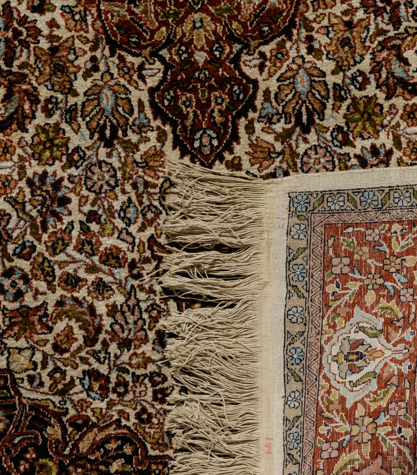 An Oriental woollen rug, decorated with hunting scènes to the center, and with animals and floral mo - Image 9 of 9