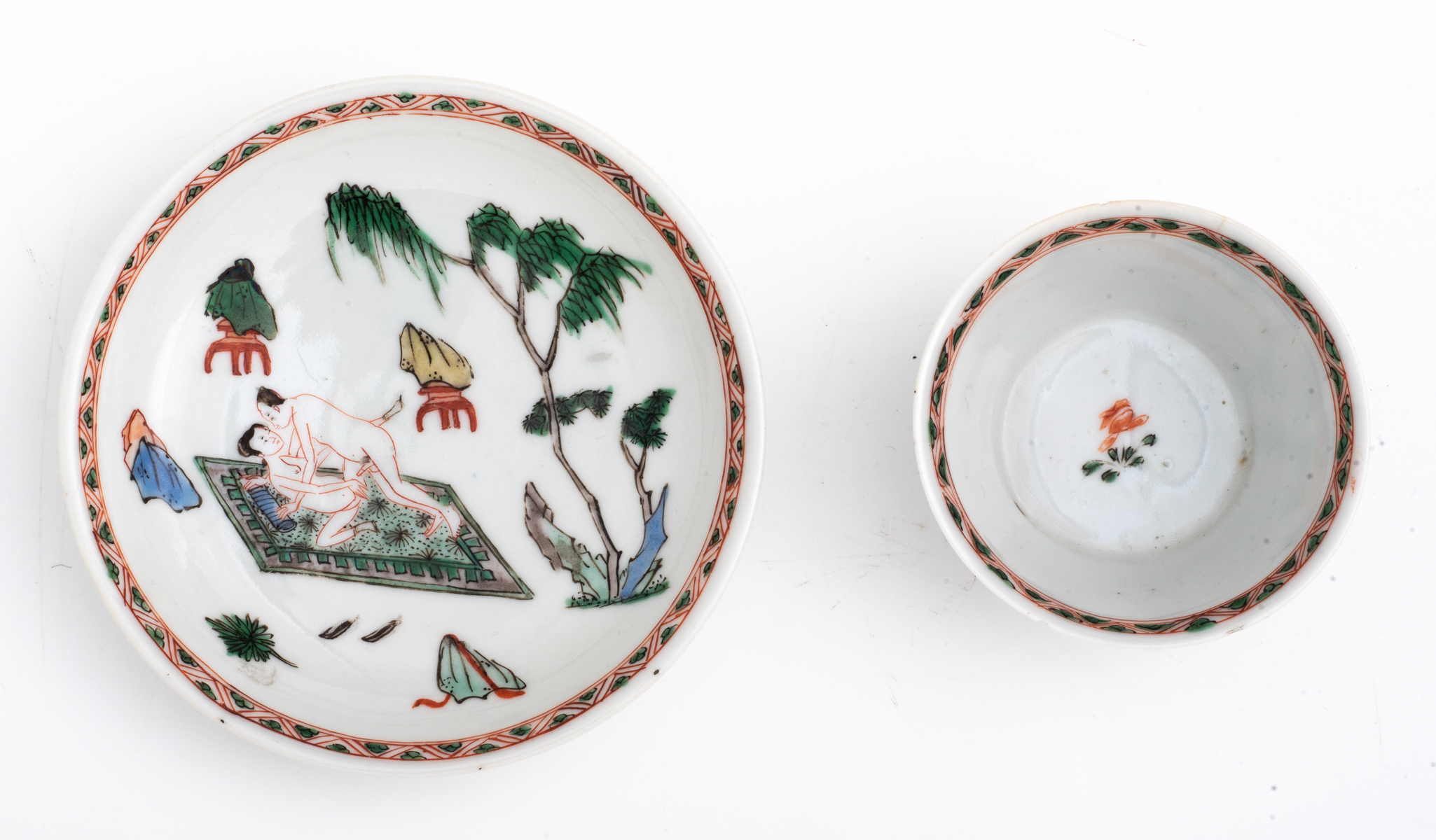A Chinese famille verte cup and saucer, decorated with an erotic scene, Kangxi symbol mark and of th - Image 3 of 7