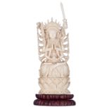 A Chinese Canton ivory eighteen-armed Guanyin, on a wooden lotus-shaped base, first half to mid-20th
