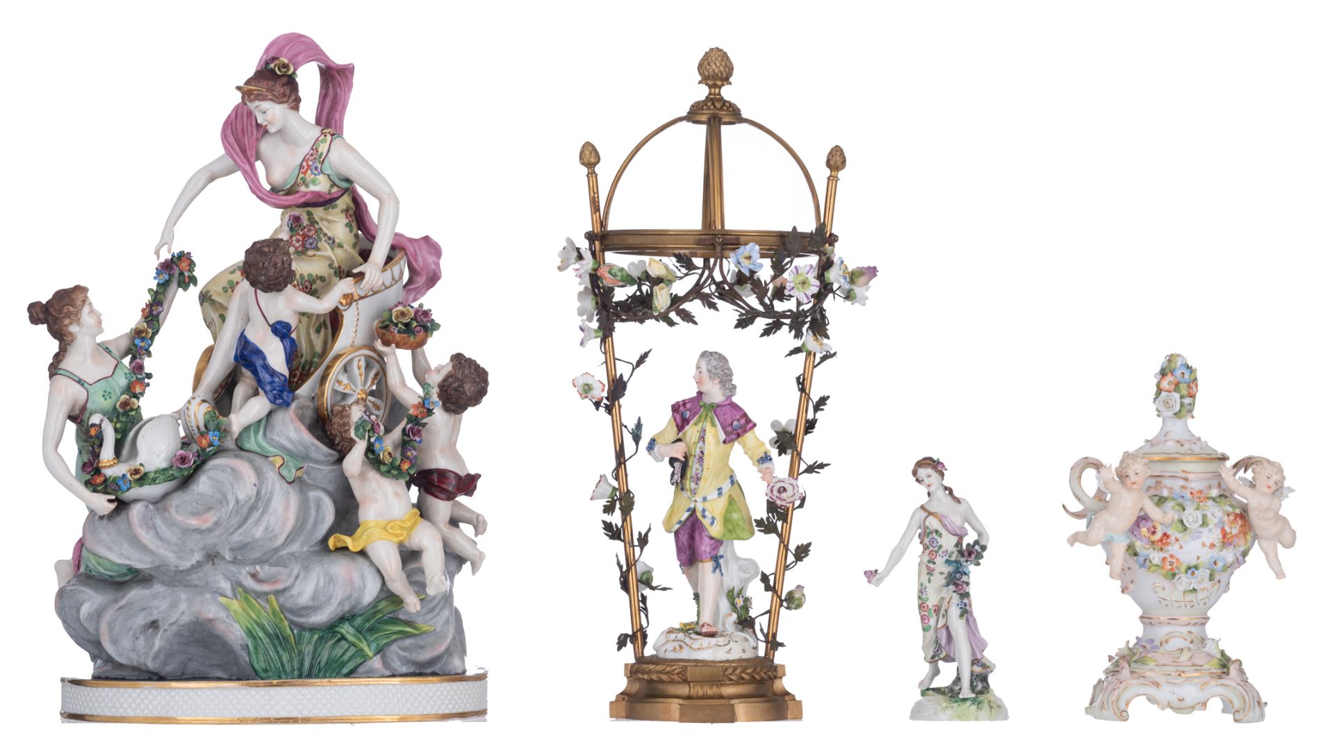 A polychrome painted porcelain group of Venus on a chariot surrounded by amor figures, marked Rudols