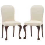 A fine pair of walnut Queen Anne style chairs, on claw-and-ball feet and with silk upholstery, H 49