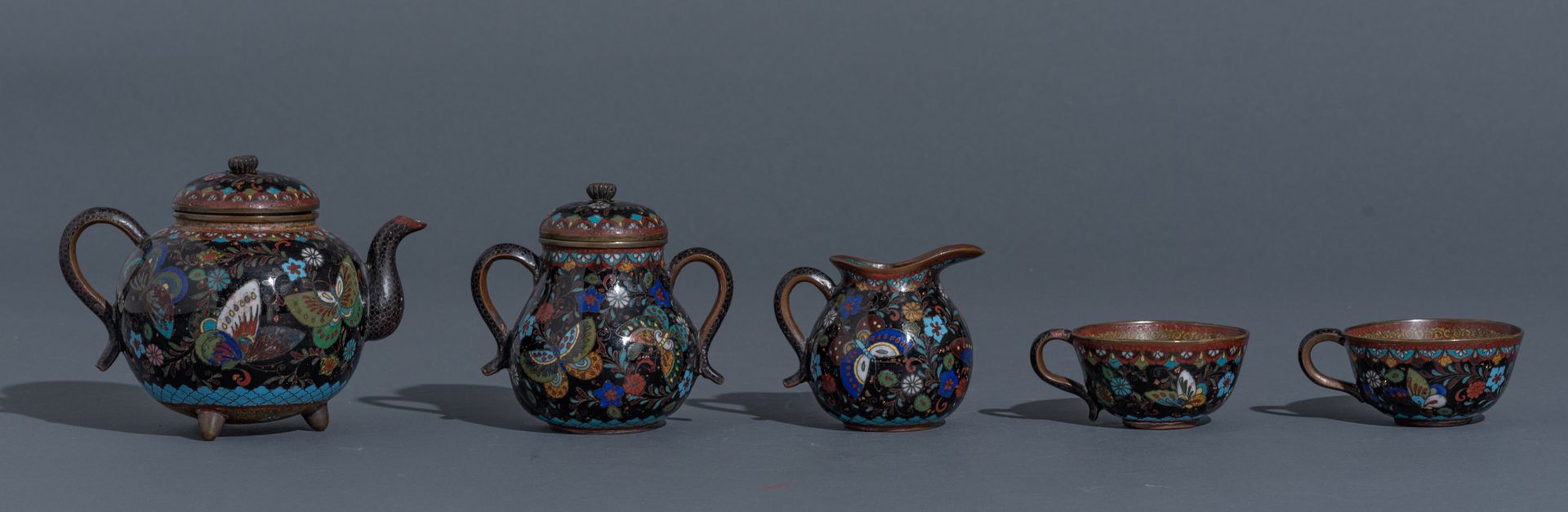 A Japanese cloisonné enamel tea set, i.e. a tray, two cups and saucers, a teapot and cover, a milk j - Image 6 of 9