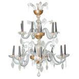 An imposing fourteen-armed Venetian glass chandelier, partly guilt and decorated with flowers and vi