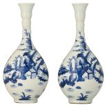 Two nearly identical Chinese blue and white bottle vases, decorated with Long Elisa and the playing