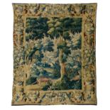 A 17thC verdure tapestry with animals in a landscape, the border finely decorated with parrots and f