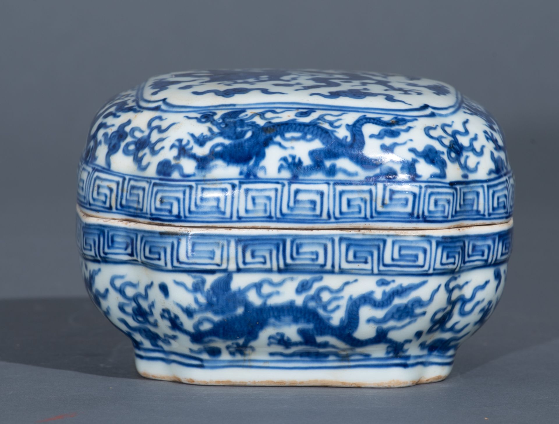 A Chinese Ming style blue and white rectangular box and cover, the top panel decorated with a dragon - Image 6 of 10