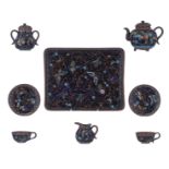 A Japanese cloisonné enamel tea set, i.e. a tray, two cups and saucers, a teapot and cover, a milk j