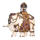 A first-half 20thC fine sculpted ivory Indian procession decorated elephant, the decoration of gilt