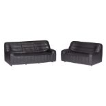 A set of two '70s design black buffalo leather DS84 settees by De Sede, consisting of a two-seater a