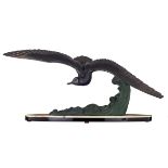 Leducq M, a flying gull, an Art Déco sculpture in patinated zamac on a green onyx and noir Belge mar