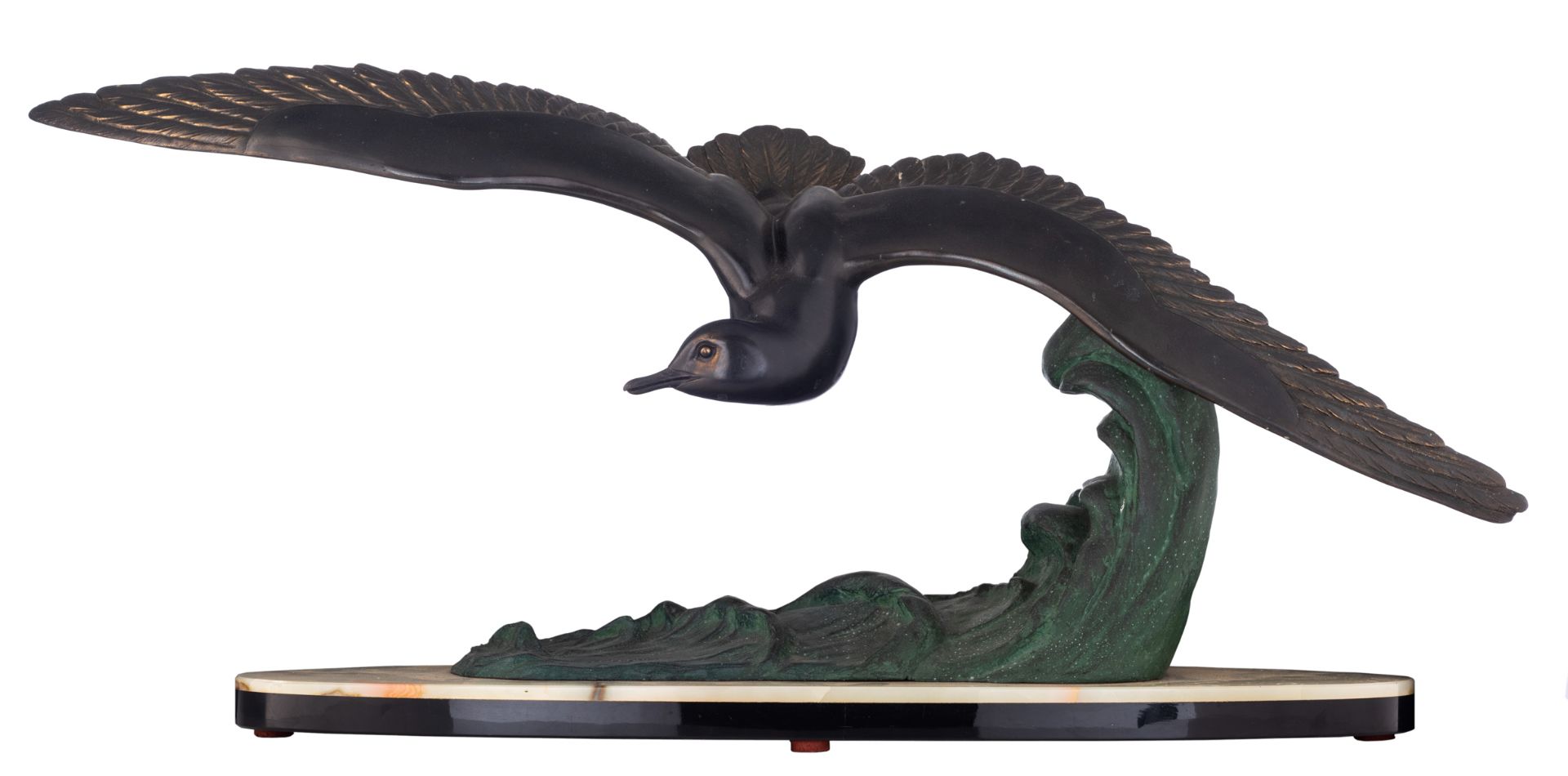 Leducq M, a flying gull, an Art Déco sculpture in patinated zamac on a green onyx and noir Belge mar