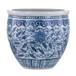 A Chinese blue and white cachepot, decorated with flower scrolls and leafy tendrils, 19thC, H 33 - ø