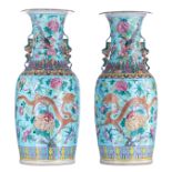 A pair of large Chinese turquoise ground and polychrome vases, decorated with flowers, dragons and p