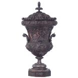 An imposing and finely sculpted walnut Renaissance Revival Medici vase, decorated with scrollwork, a