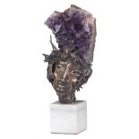 No visible signature, the head of a man, amethyst and polished bronze on a Carrara marble base, H 31