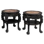 Two Chinese exotic hardwood stands, richly carved with floral decoration, dragon heads and standing