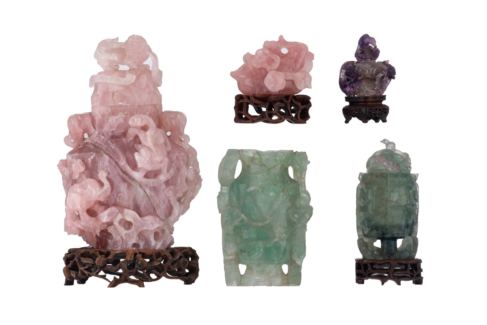 Five Chinese pink quartz, green quartz and purple quartz carved groups, depicting various display it