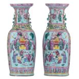 A pair of Chinese yellow and pale blue ground floral decorated famille rose vases, the panels with s