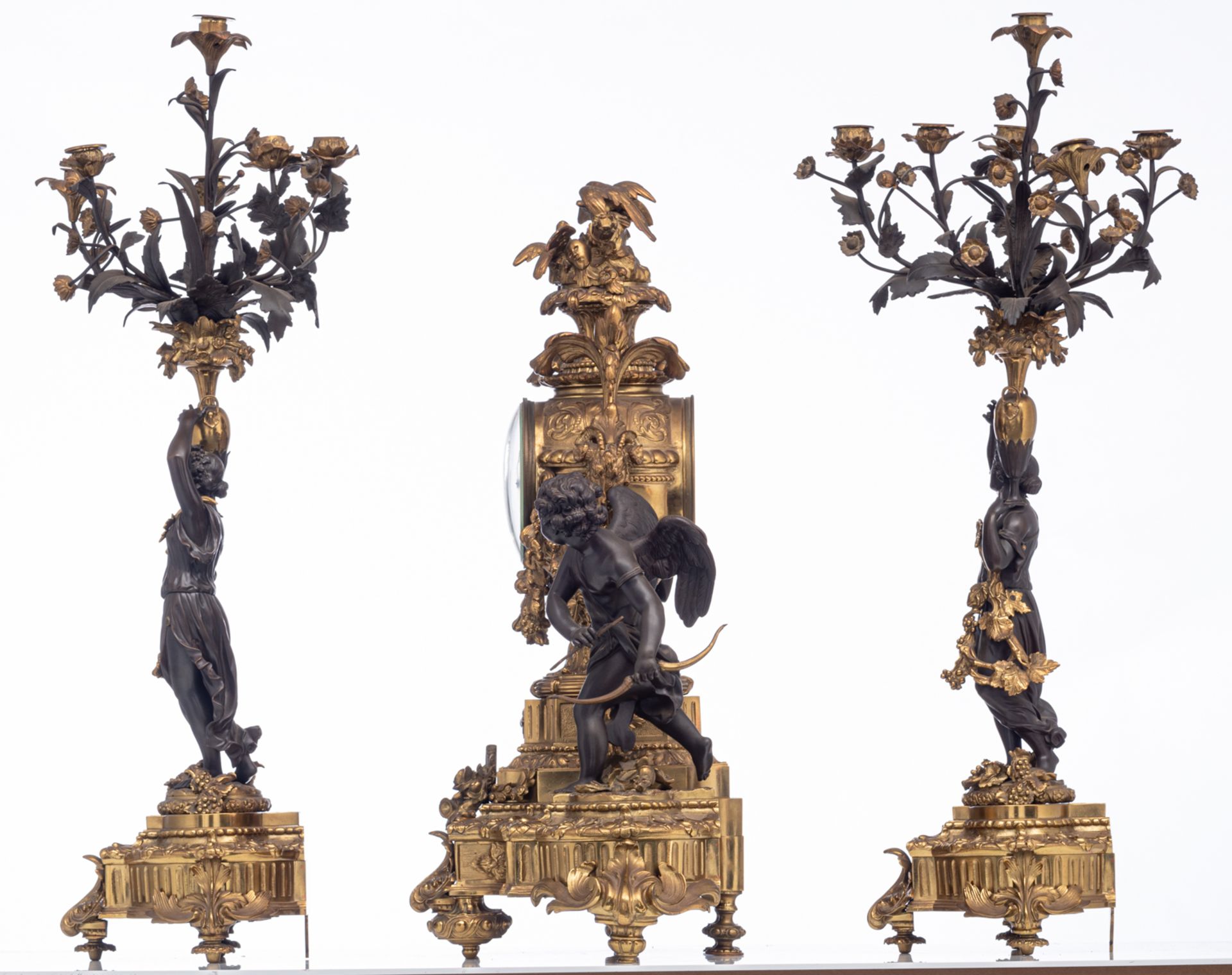 An imposing gilt and patinated bronze Neoclassical three-piece mantle clock garniture, the clock dec - Image 2 of 9