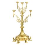 An imposing bronze Gothic Revival floor candelabra on lion-shaped feet, the six arms decorated with