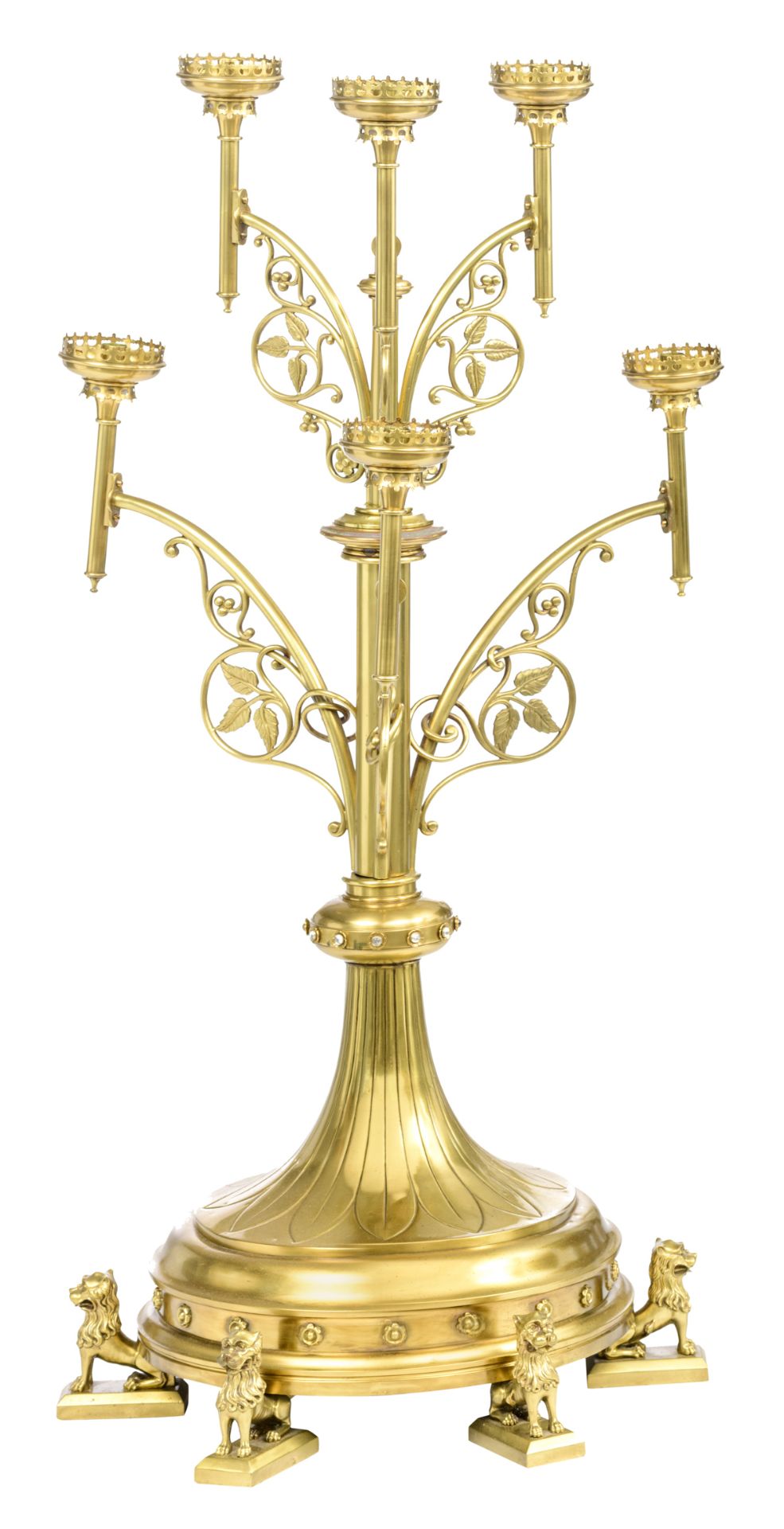 An imposing bronze Gothic Revival floor candelabra on lion-shaped feet, the six arms decorated with