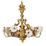 A gilt and patinated bronze chandelier, decorated with horns of plenty and angels holding the arms o