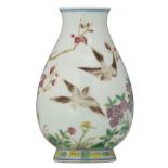 A Chinese famille rose hu vase, finely painted with birds on flower branches, with a Tongzhi mark, H