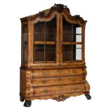 An imposing Neoclassical mahogany veneered Dutch display cabinet with floral marquetry, the top with