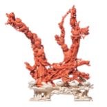 A Chinese late Qing dynasty fine hand-carved red coral sculpture depicting two beauties and a child