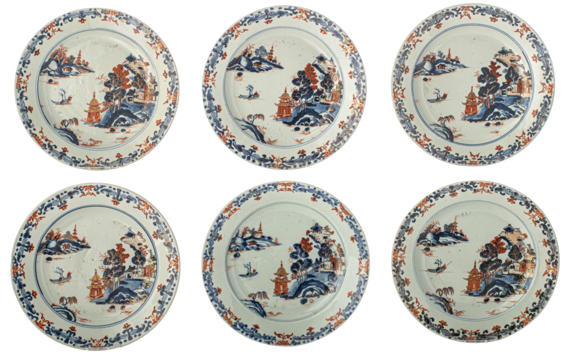 Six Chinese Imari decorated dishes, the centre with a pagoda in a mountainous river landscape, 18thC