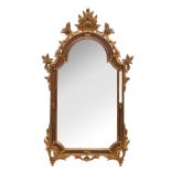 A richly sculpted gilt wooden wall mirror in the Venetian manner, 82 x 14 cm