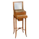 A fine1930s maple burl veneered ladies vanity box on a stand containing all kind of tools for a lady