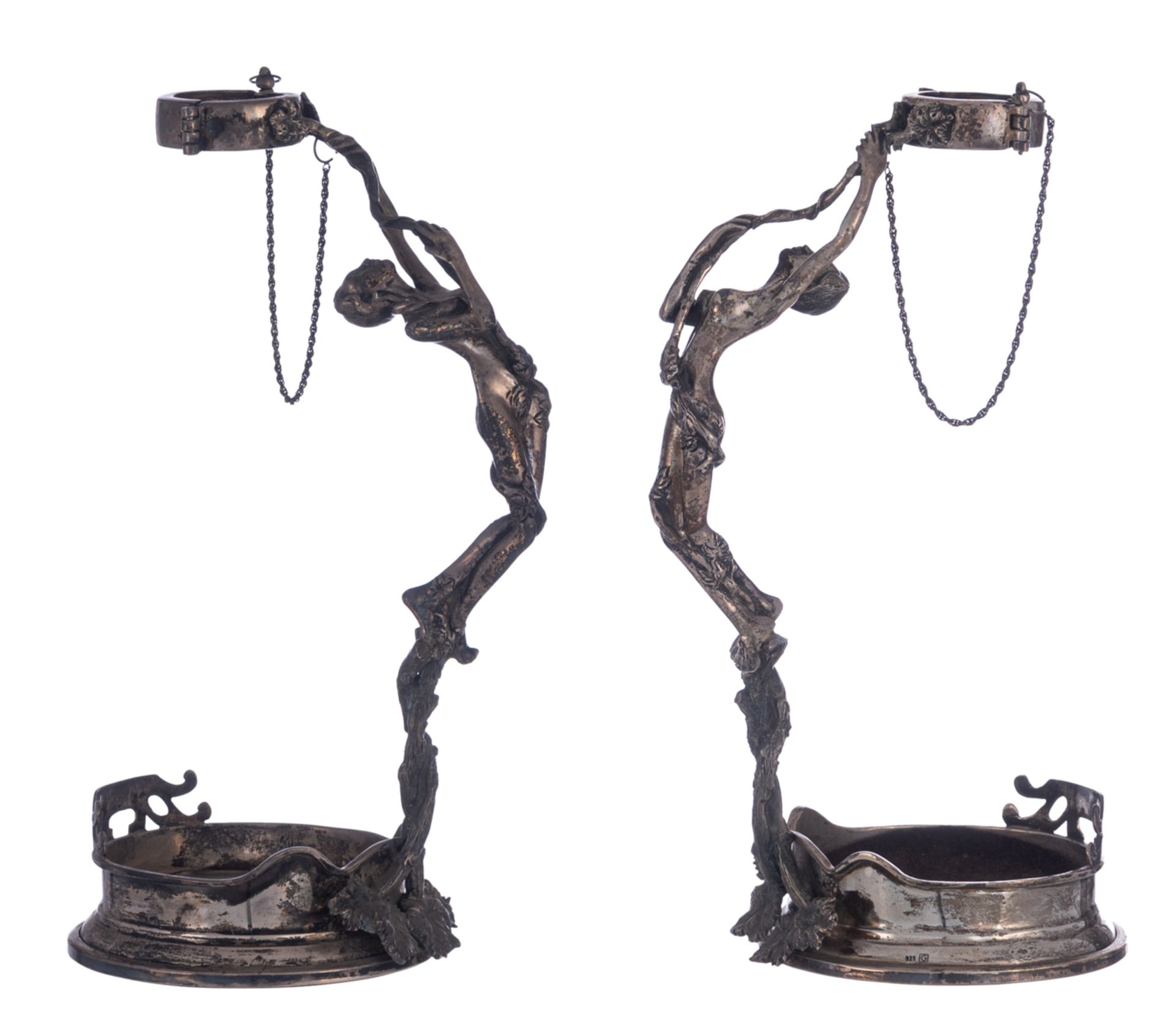 A pair of 925/000 silver wine bottle holders, both shaped as nymphs holding the bottleneck, probably
