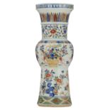 A Chinese wucai yenyen-vase, overall decorated with flowers and flower baskets, with a Wanli mark, H