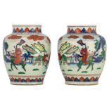 A pair of Chinese wucai jars, overall decorated with a qilin bringing the boys, H 32 cm