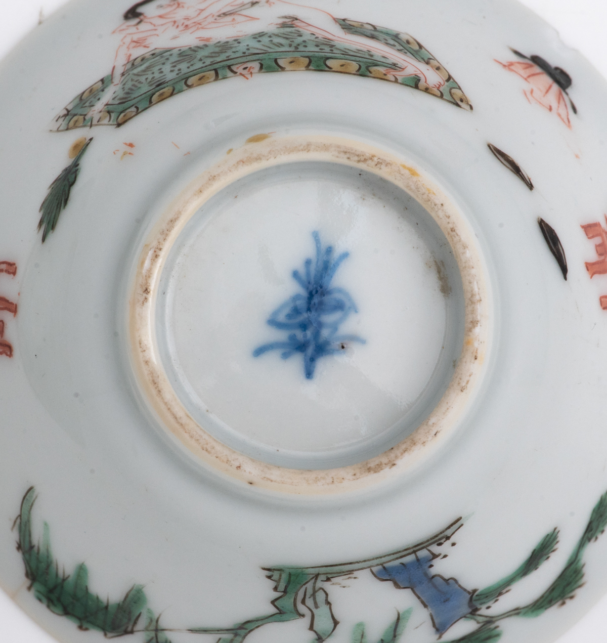 A Chinese famille verte cup and saucer, decorated with an erotic scene, Kangxi symbol mark and of th - Image 5 of 7