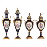 Two pairs of covered bleu royale ground Sèvres type vases with gilt bronze mounts, the roundels poly