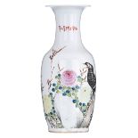 A Chinese polychrome vase, decorated with a raven on flower branches, the back with signed texts, H