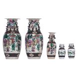 Five Chinese famille rose and polychrome stoneware Nanking relief vases, overall decorated with hunt